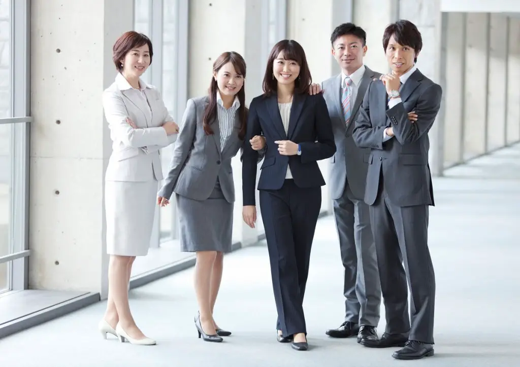 Funeral goers in suits