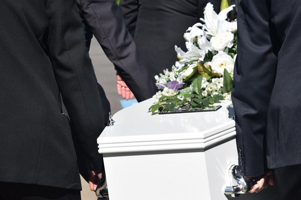 white casket for in-ground burials