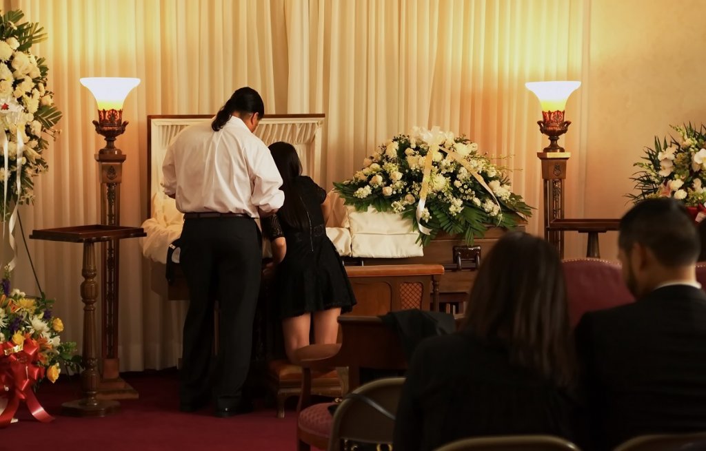 mourners at the casket