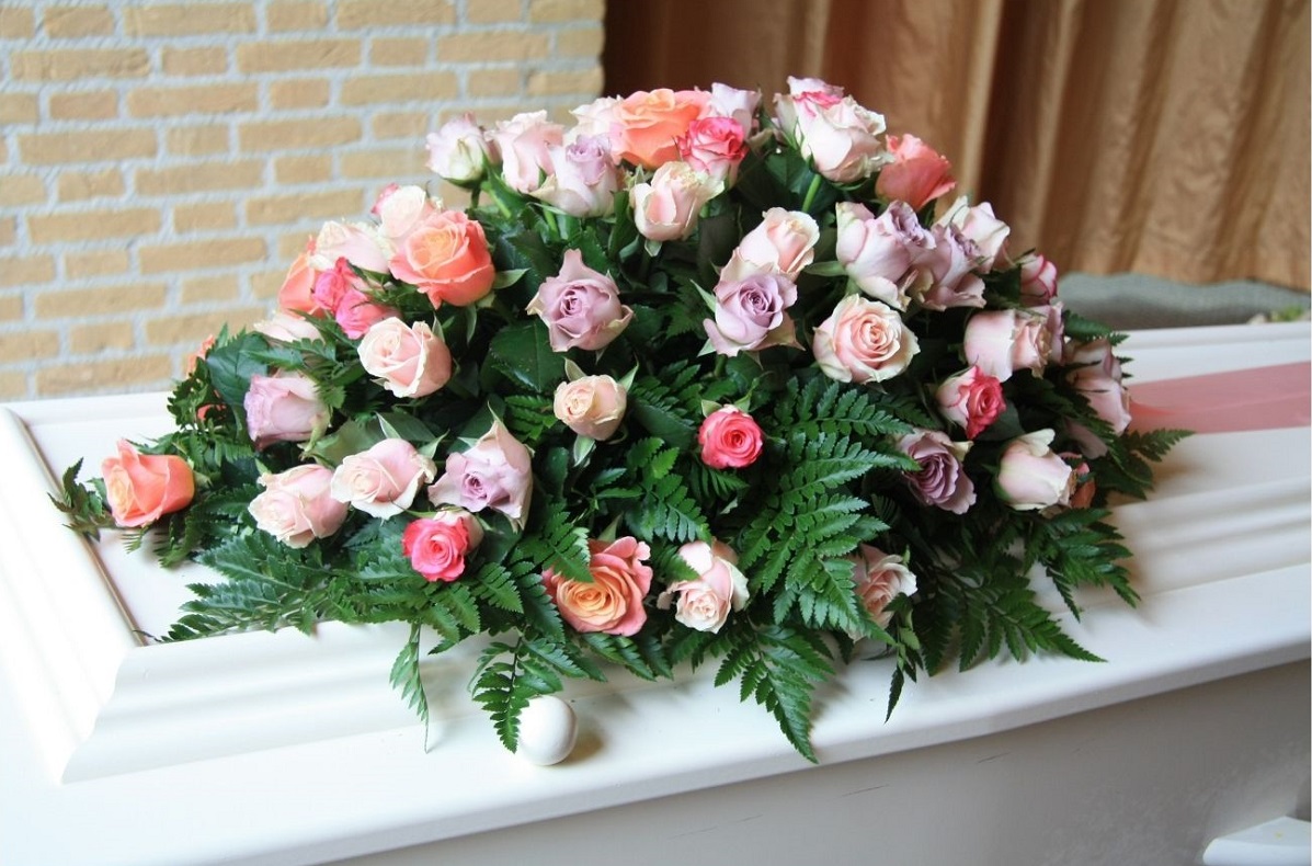 Pink roses on casket