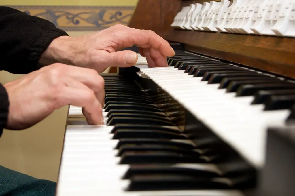 Organist playing Catholic funeral hymns