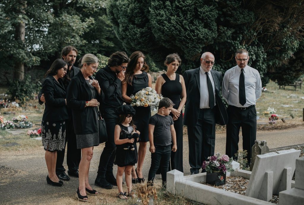 Grieving family at cemetery